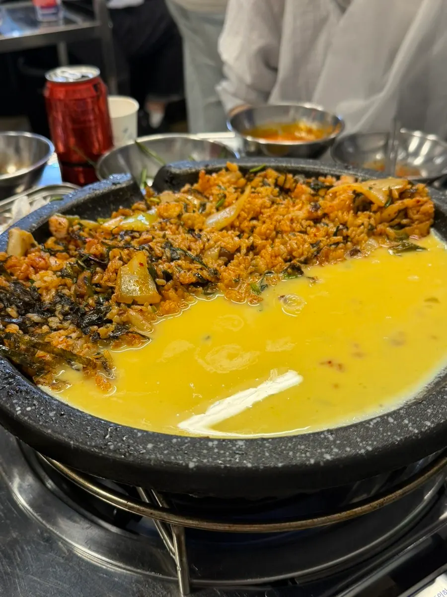 Kimchi fried rice topped with a half-moon of beaten egg