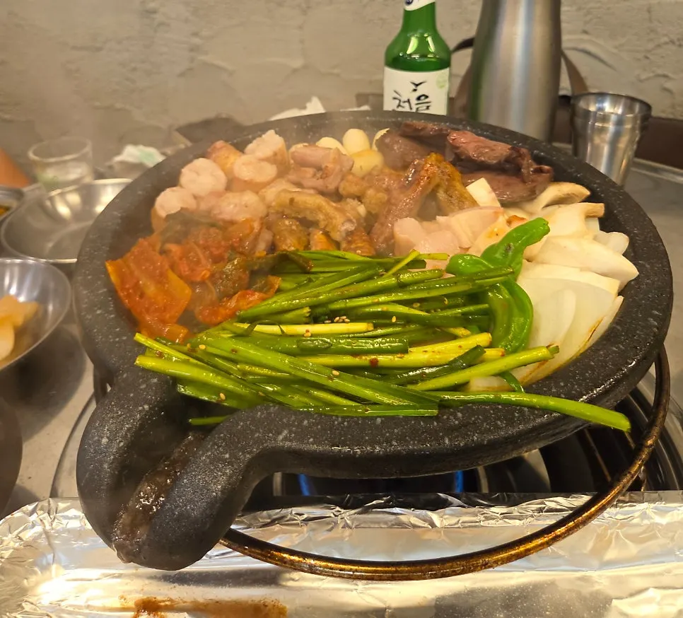 Assorted cuts from the Pujim Half Platter on the grill