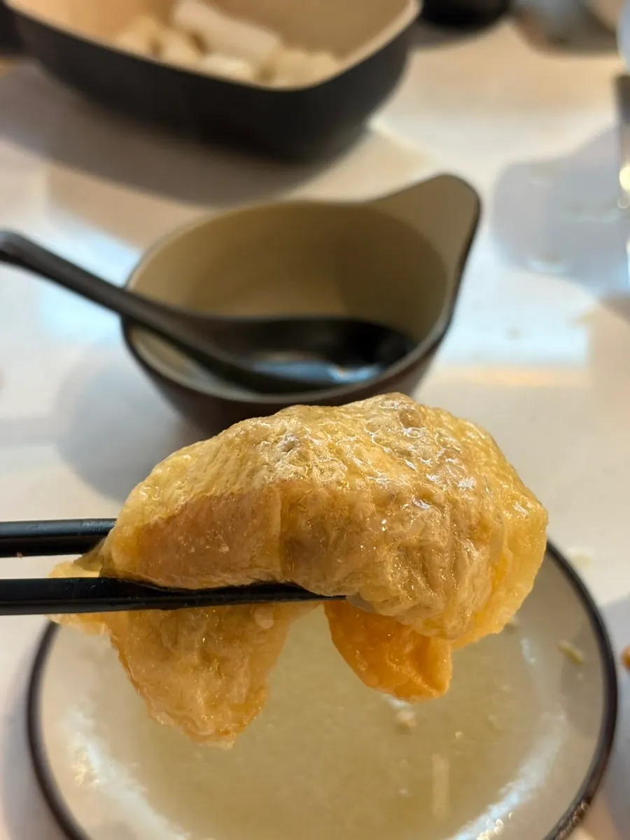 A bite of hot pot meat dipped lightly in broth