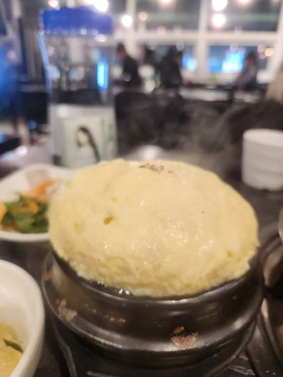 Side dishes served with jjukumi hot-plate stir-fry