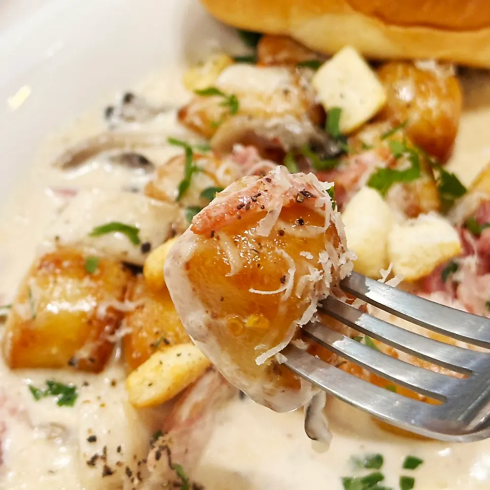 Close-up of chewy potato gnocchi and cream sauce