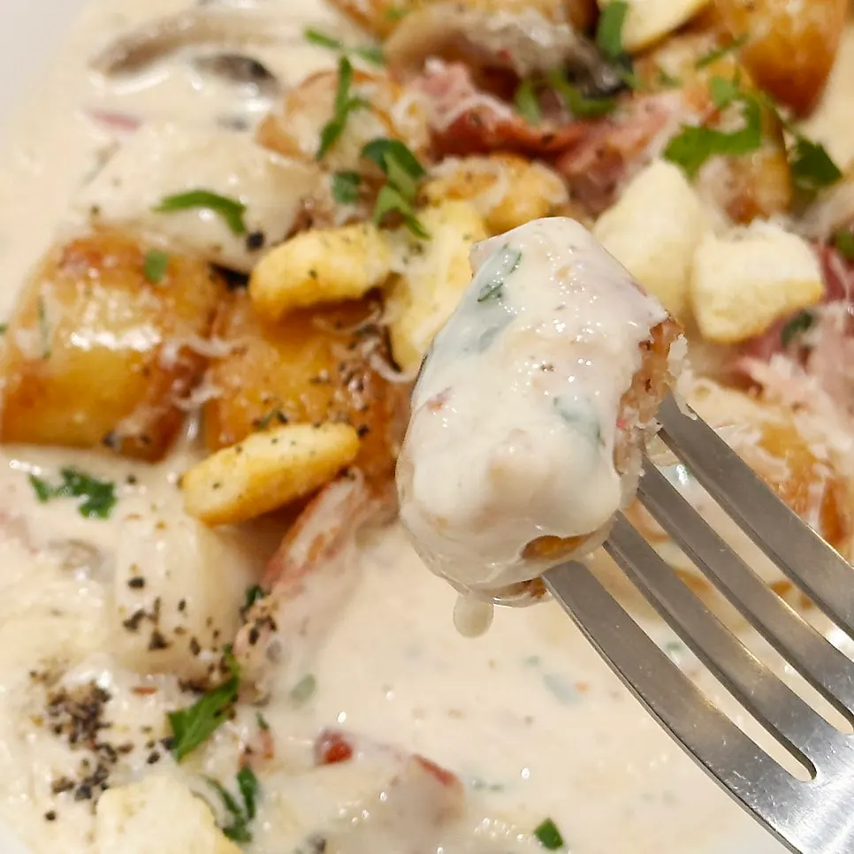 Cream gnocchi topped with bacon and croutons