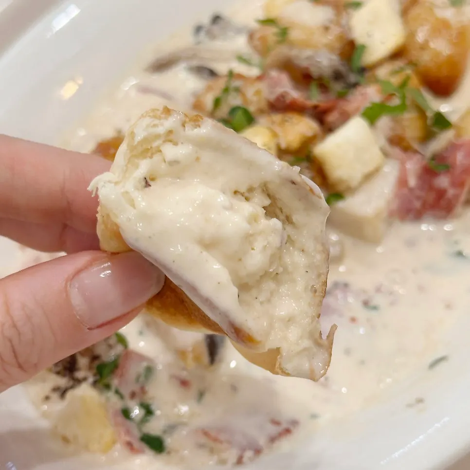 Morning bread dipped into cream sauce