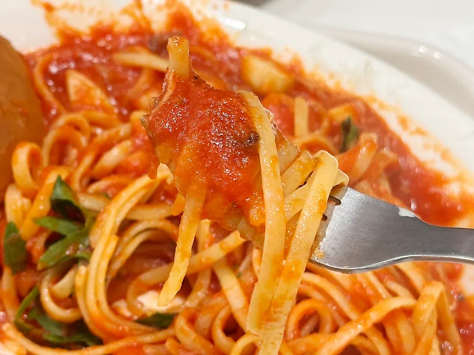 Close-up of tomato pasta loaded with shrimp