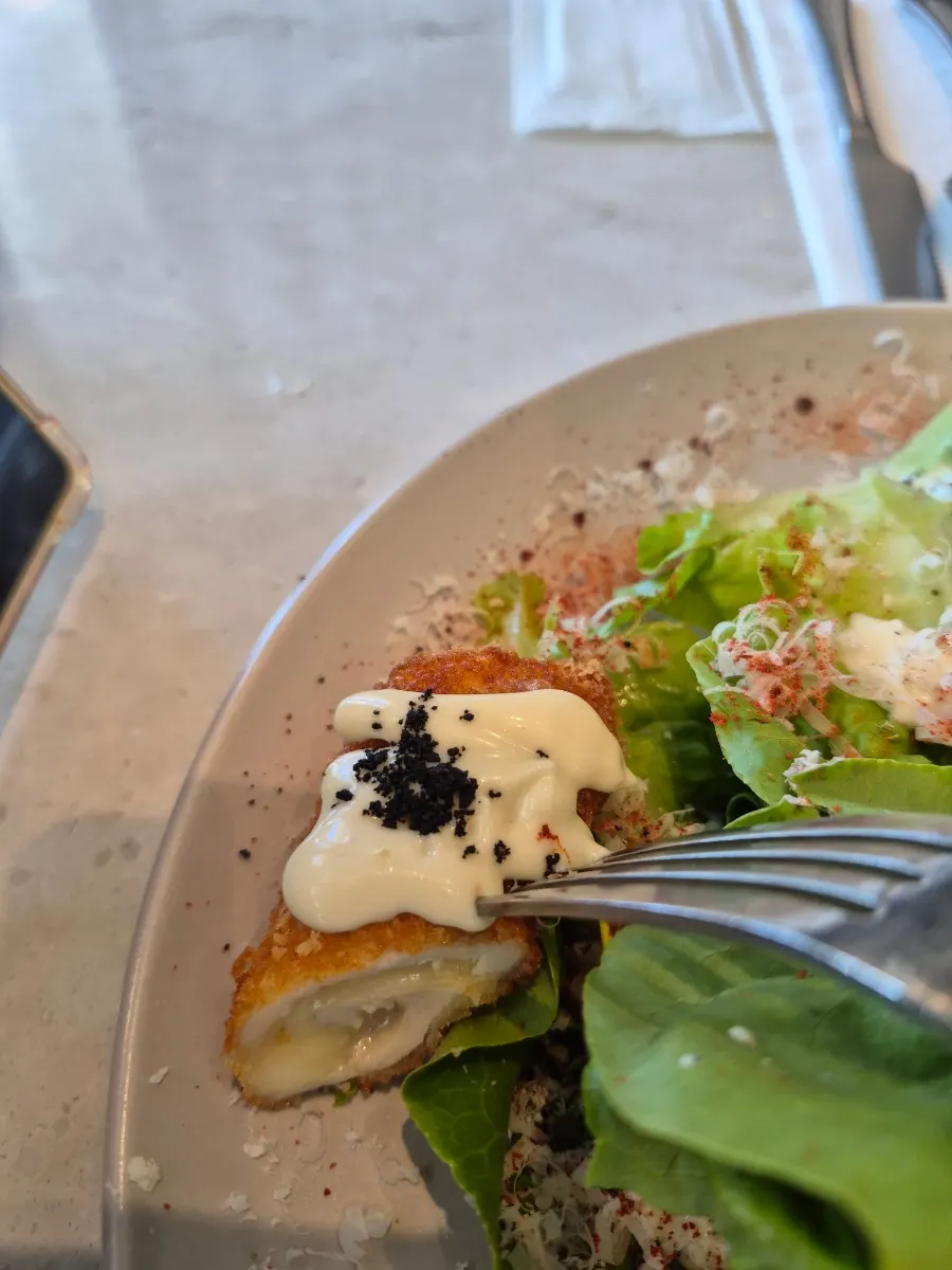 Digging into the chicken cordon Caesar salad