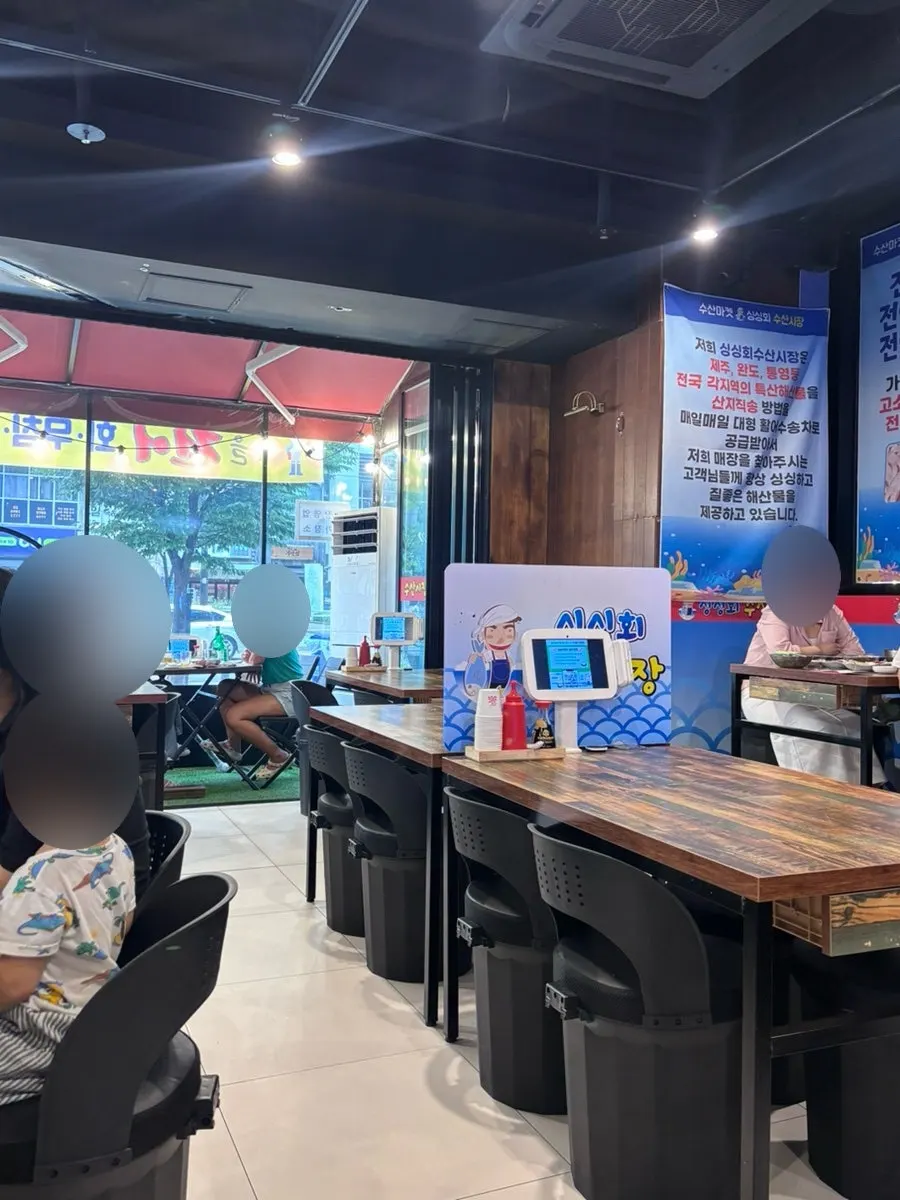 Restaurant seating with plastic-curtain outdoor-style tables