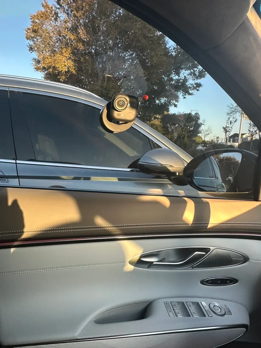 Mount attached to a car window and windshield