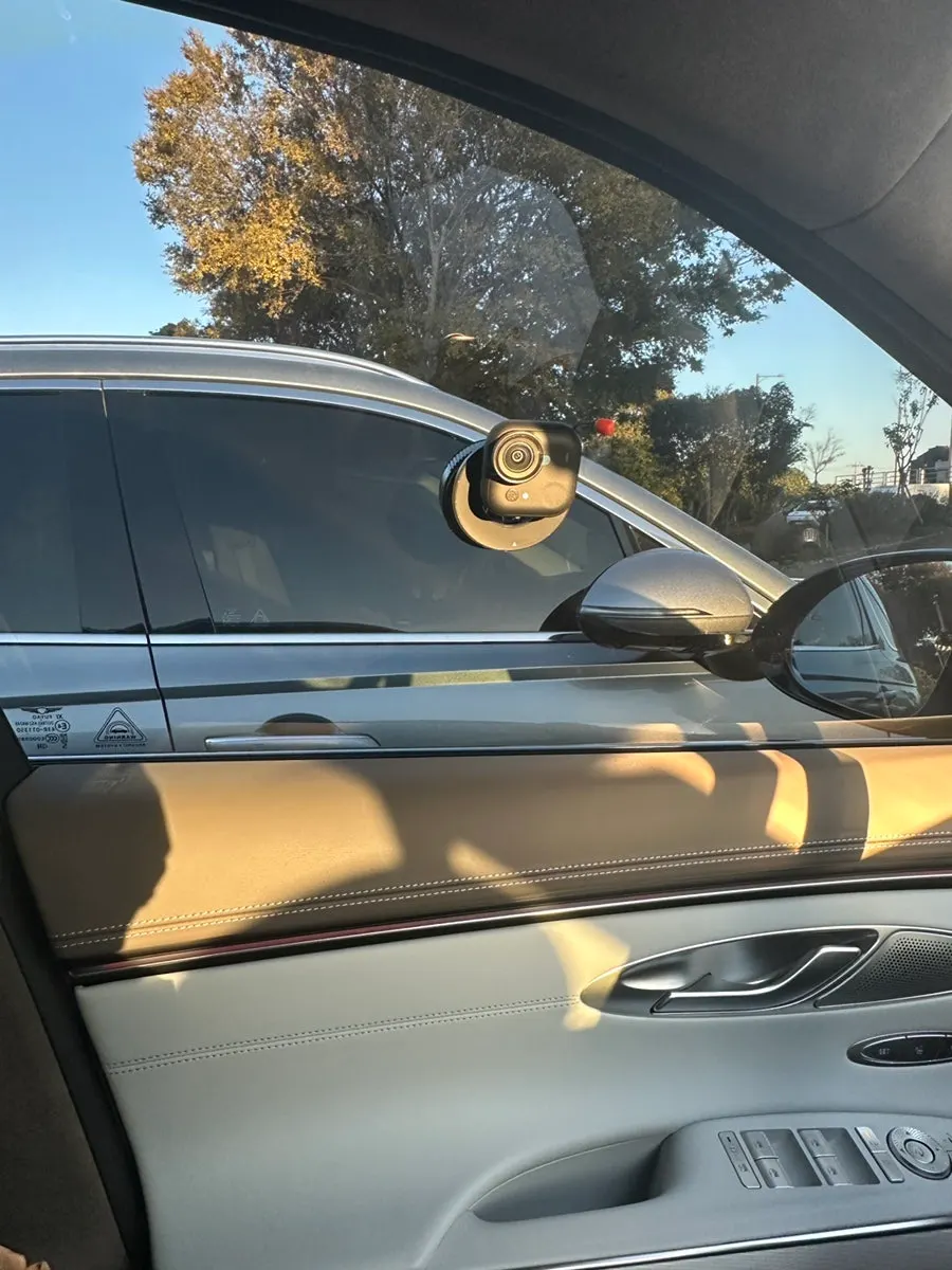 Mount attached to a car window and windshield