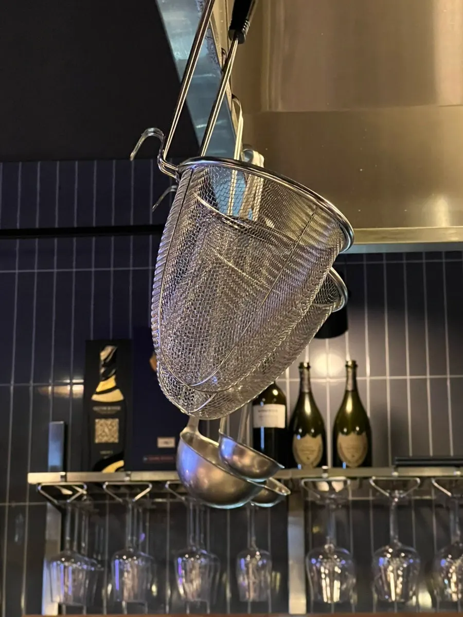 A clean strainer in the open kitchen
