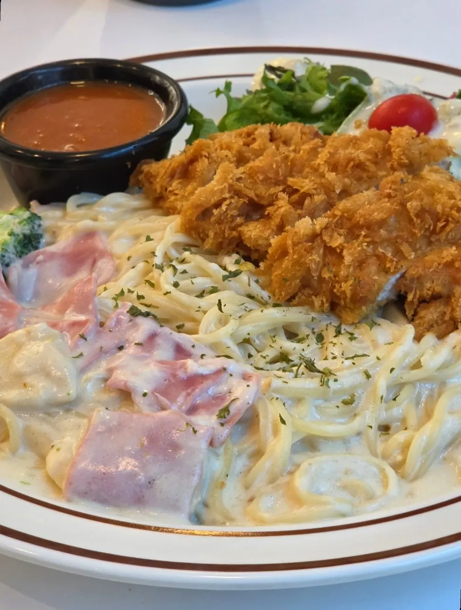 A plate of bacon cream spaghetti