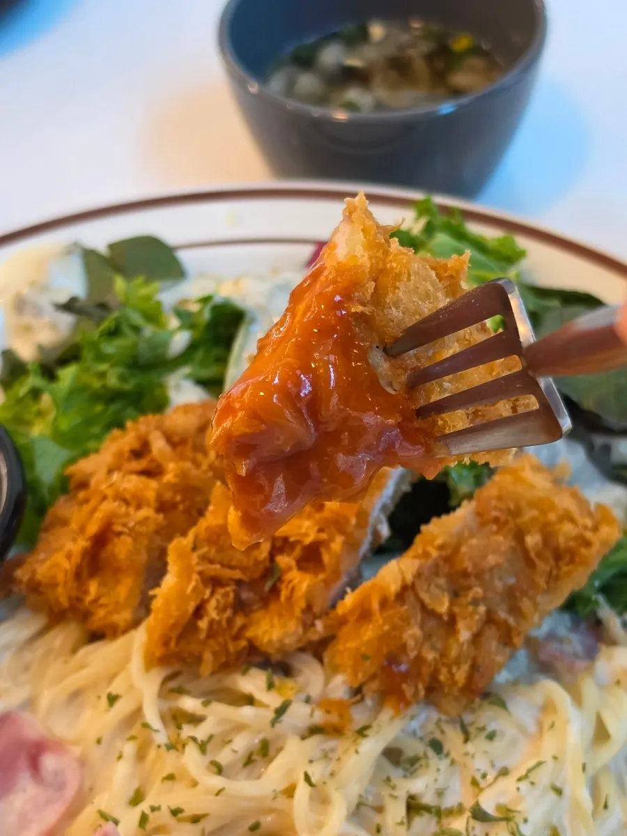 Close-up of the crispy-outside, juicy-inside mini pork cutlet