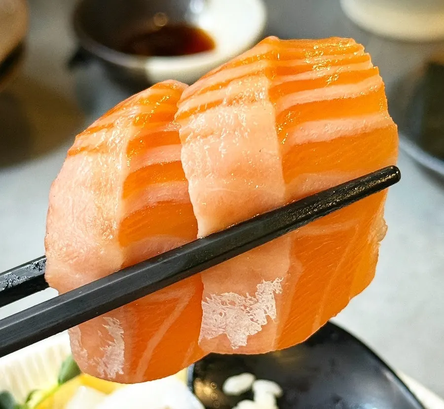 A thick-cut piece of sashimi
