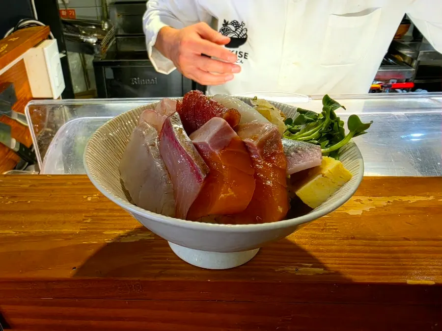Table set with pickled radish, soy sauce and broth