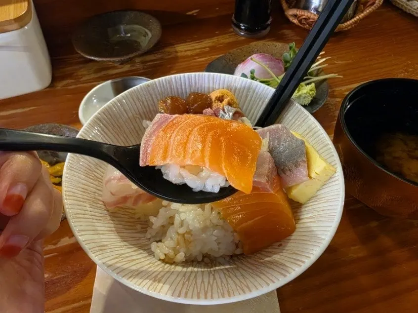 Close-up of sushi made with wasabi on top
