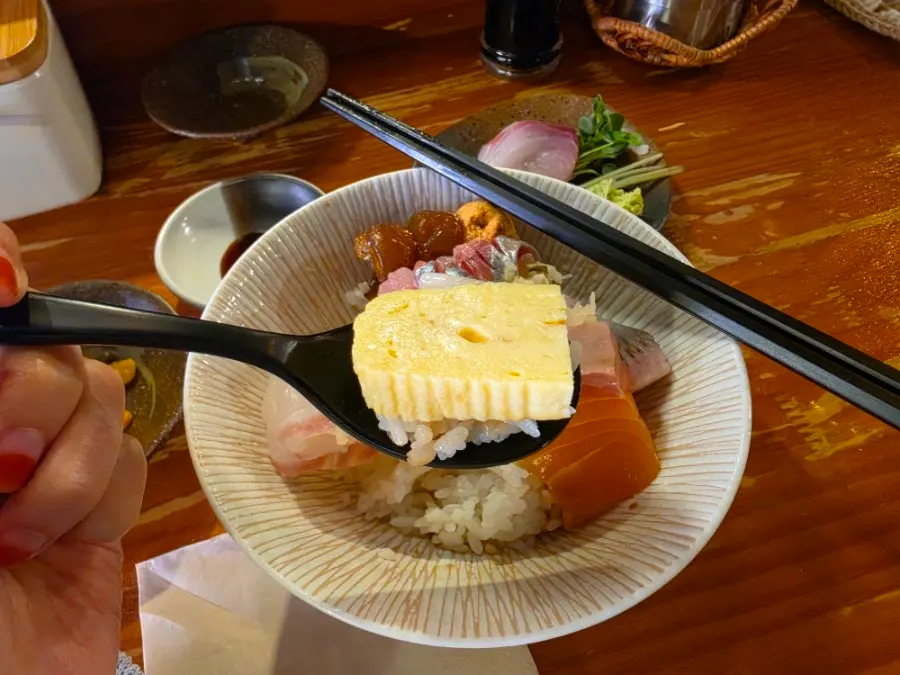A piece of sushi made from kaisendon sashimi