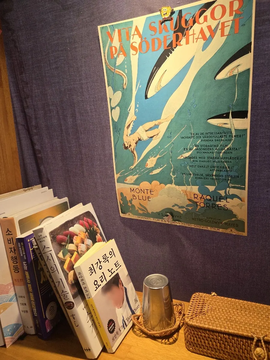Wall hung with Japanese-style posters and knick-knacks