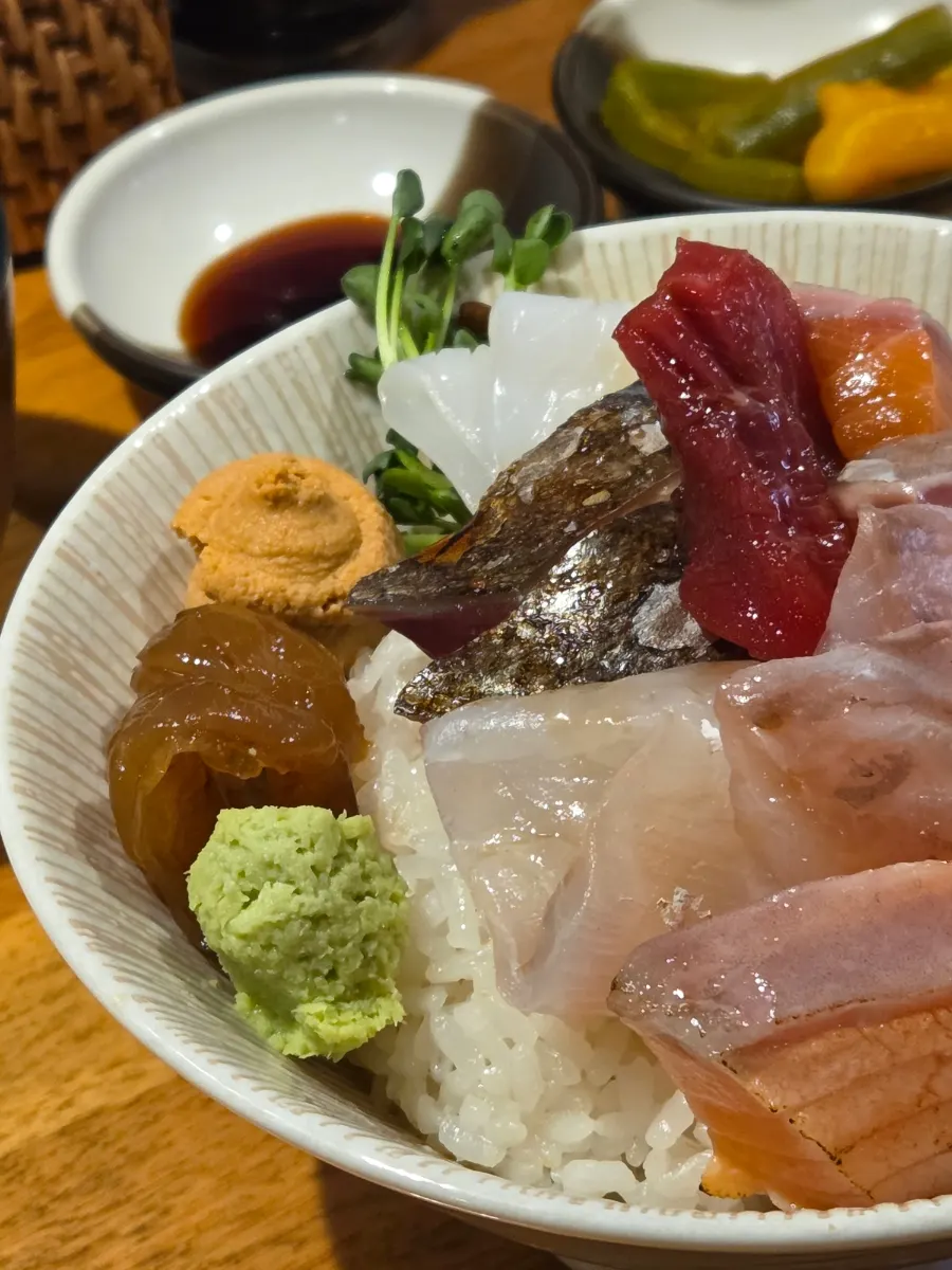 A rice bowl topped with thickly sliced sashimi