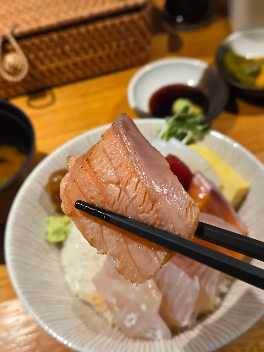 A small dish of soy sauce mixed with wasabi