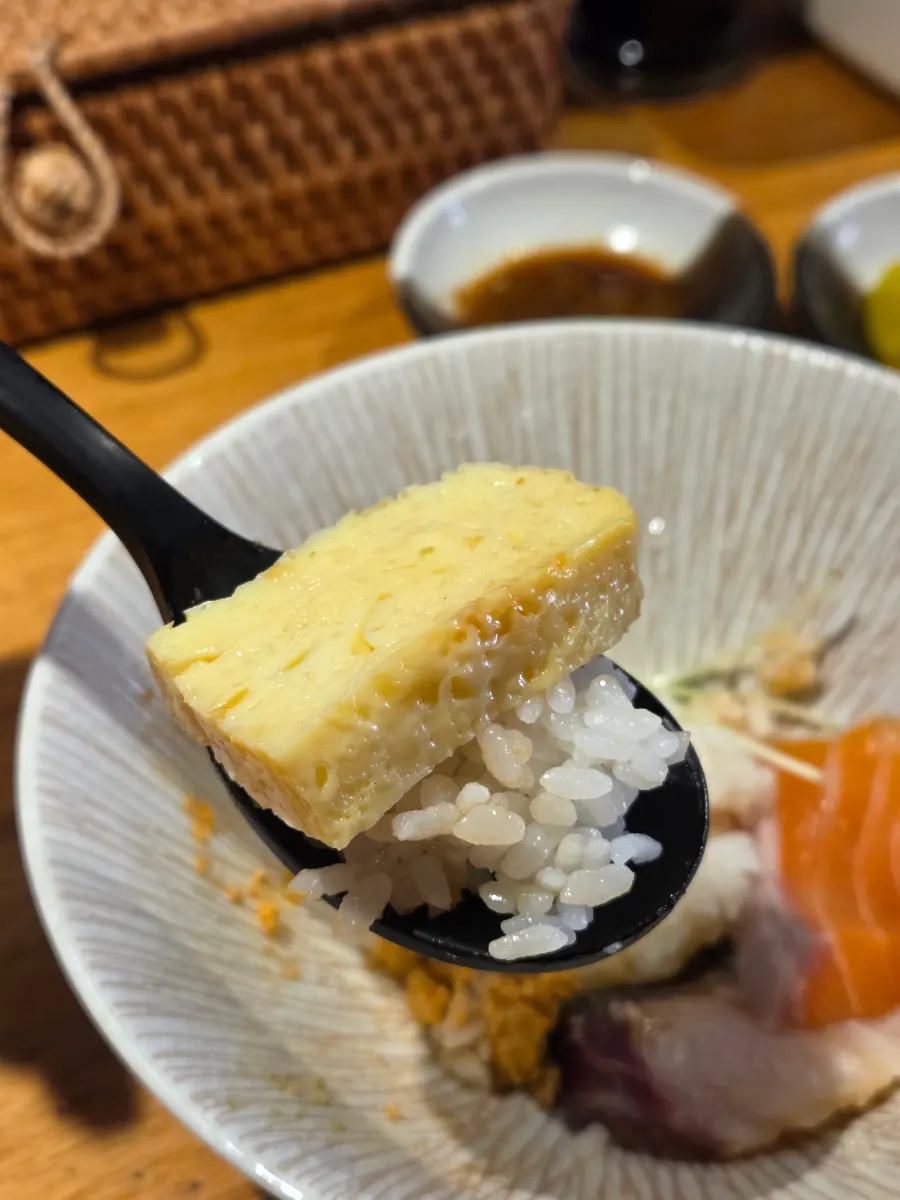 Egg made into a sushi bite over rice