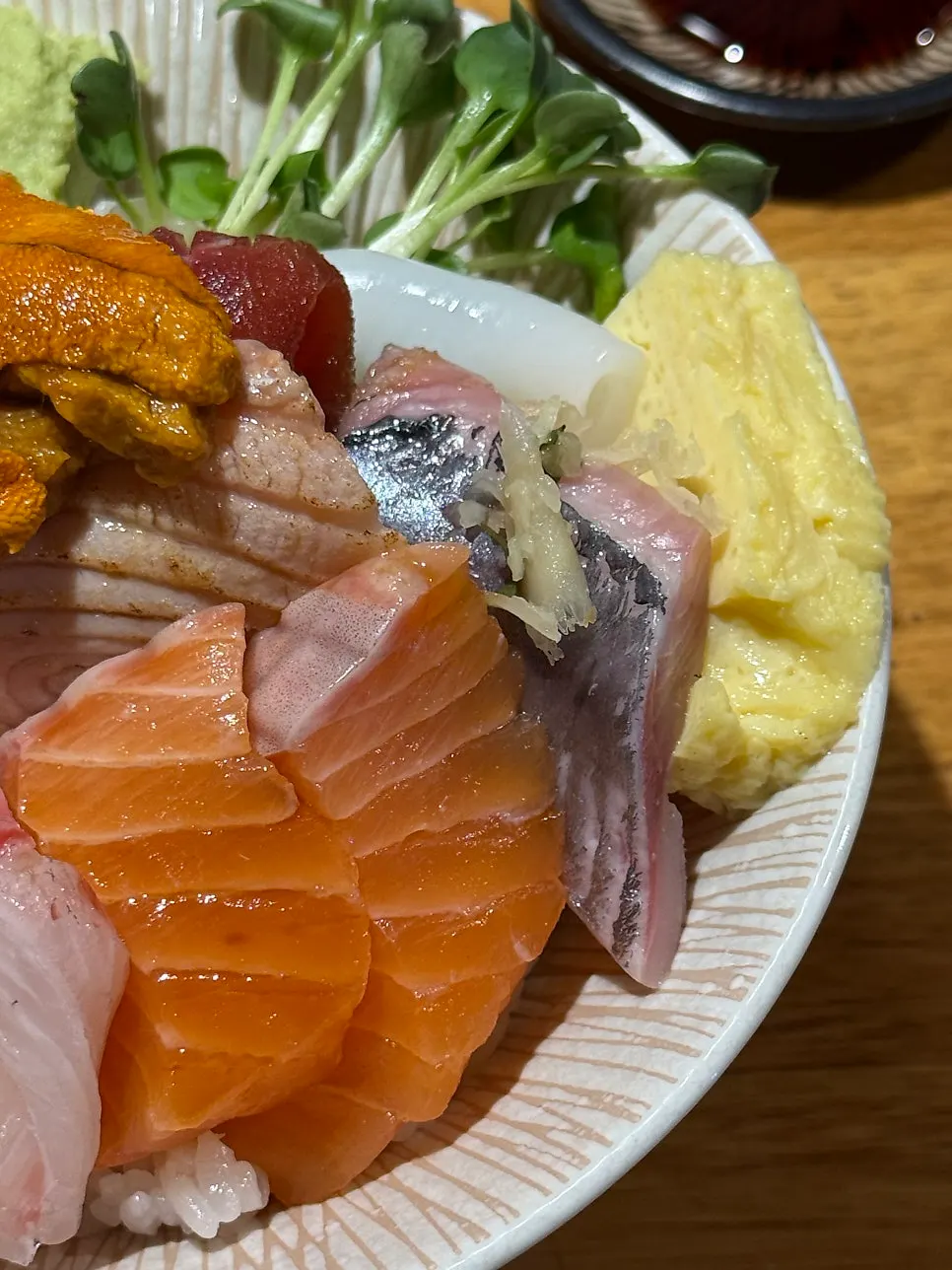 Close-up of Koshihikari rice beneath the kaisendon