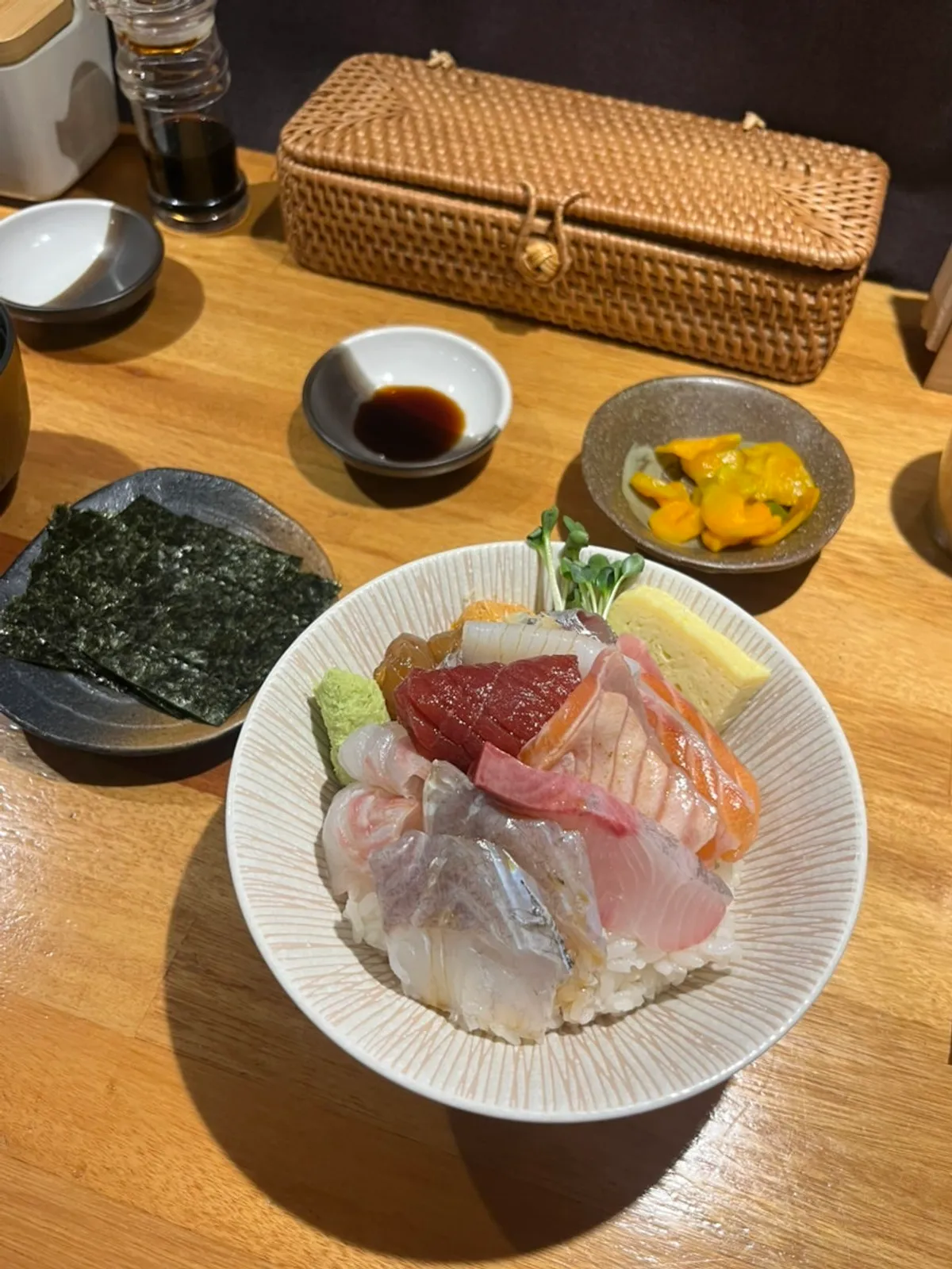 A bowl of kaisendon topped with a variety of sashimi