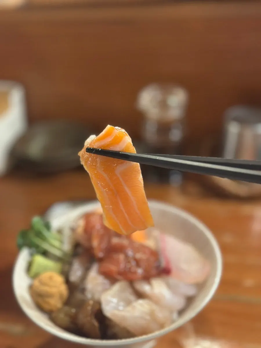 Close-up of layered sashimi varieties on the kaisendon