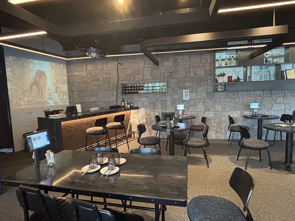 Wall showing beam projector video inside the restaurant
