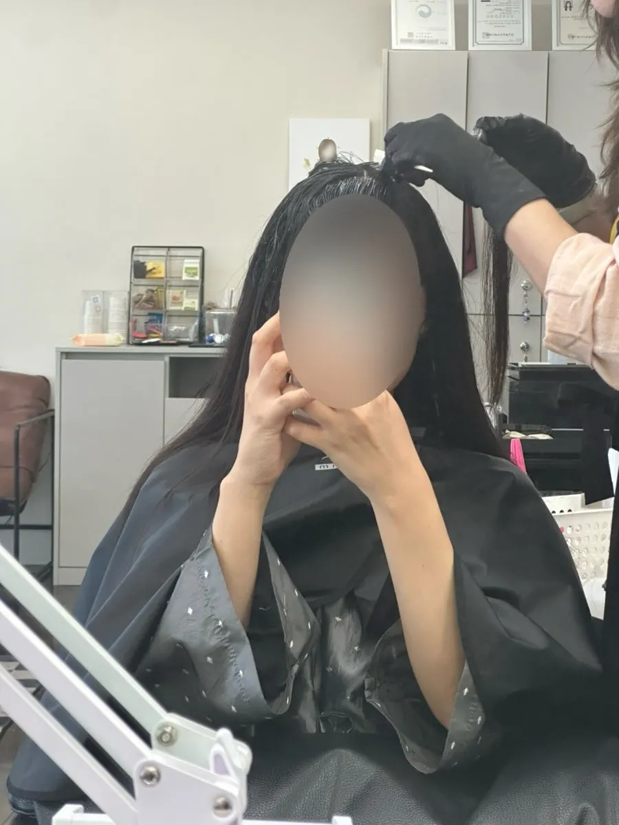 Hair with the magic straightening solution applied