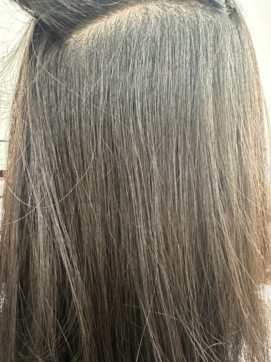 Back view of the finished hair texture after magic straightening