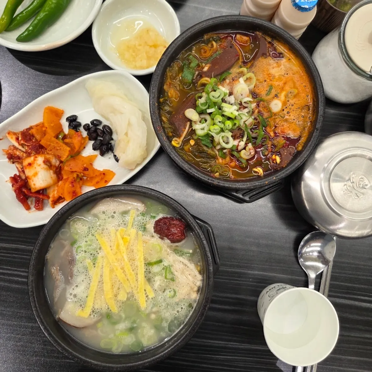 A spread of seonji haejangguk, hanchi mulhoe, and sagol gomtang