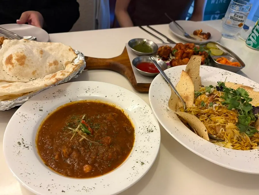 Table at the end of a meal shared among four friends