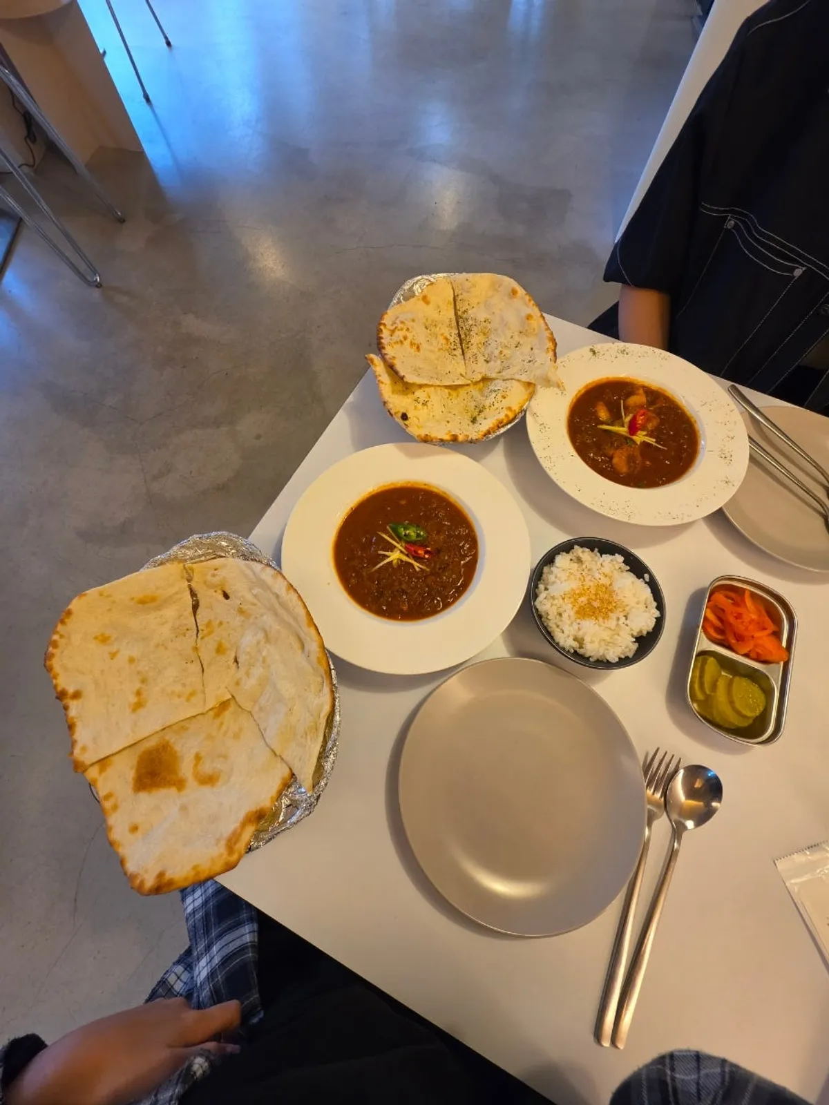 Plain naan and butter naan cut into four pieces each