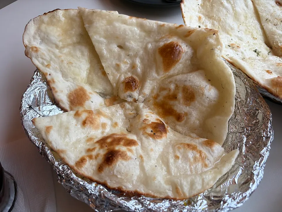 Cross-section of torn garlic naan