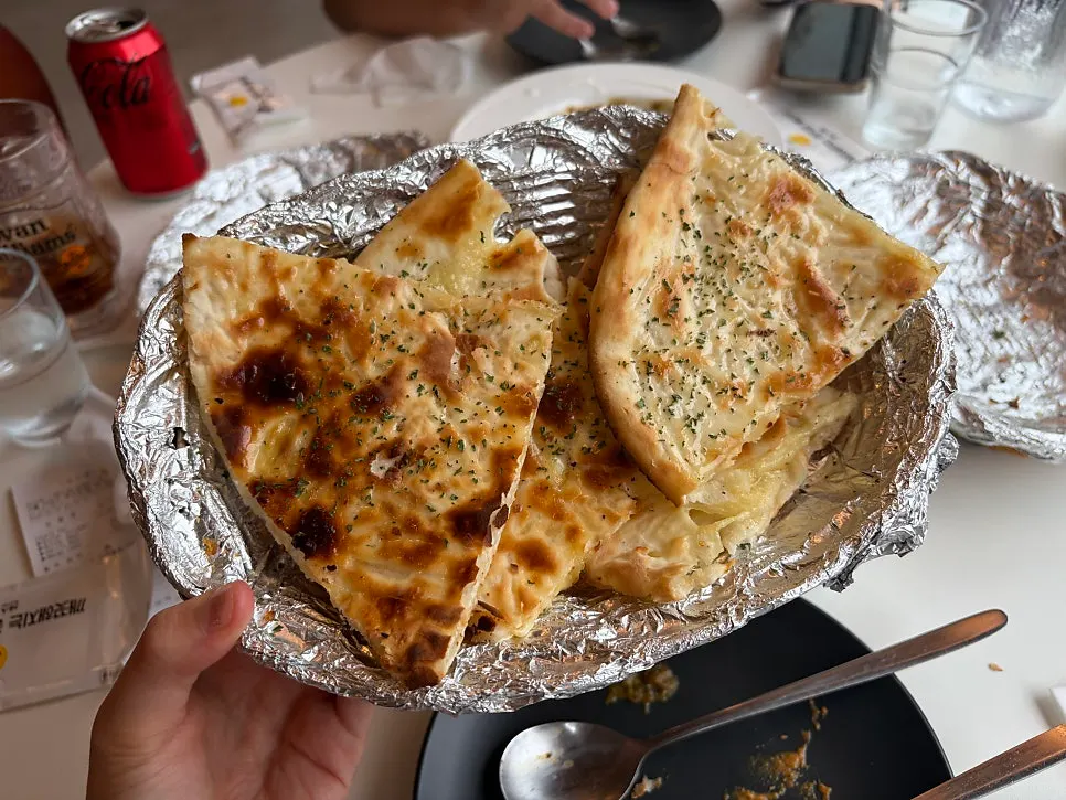 The extra cheese naan we ordered