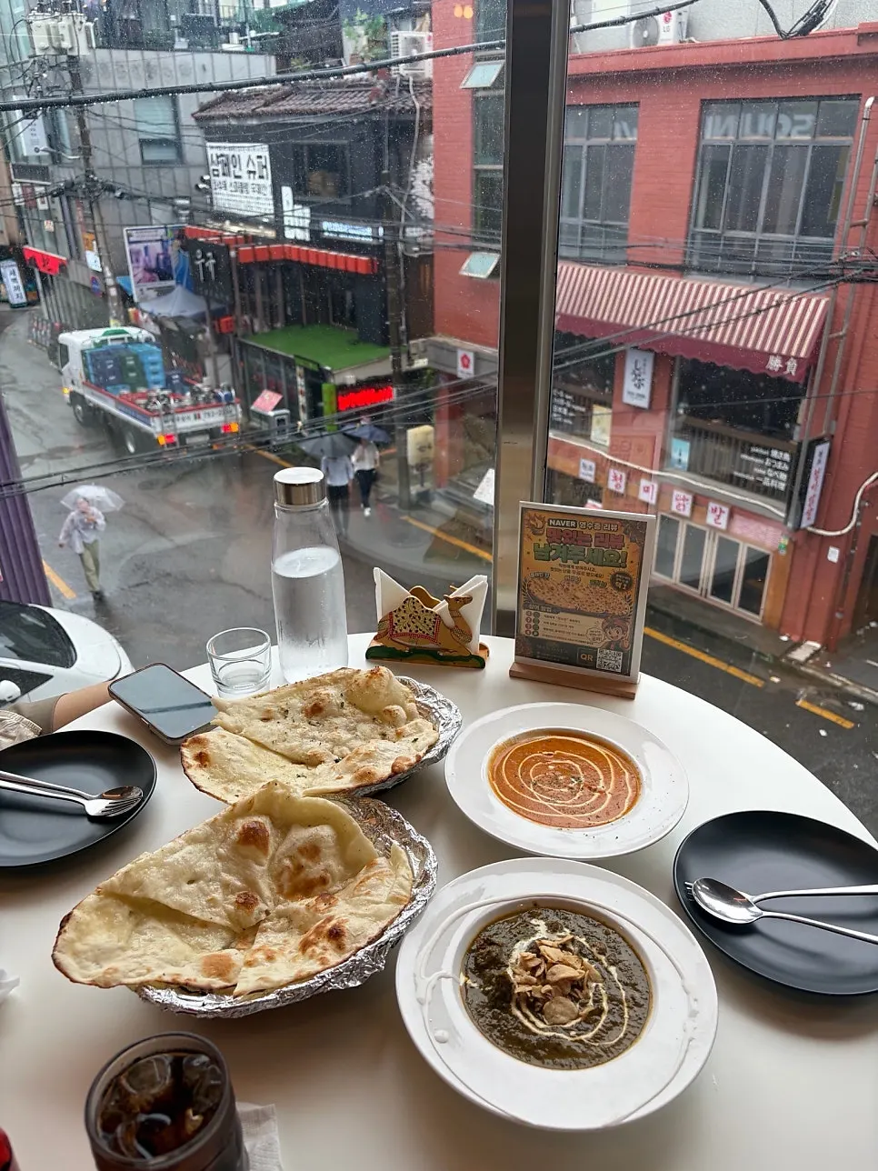 Seating by the full window at Mandala Indian Lounge