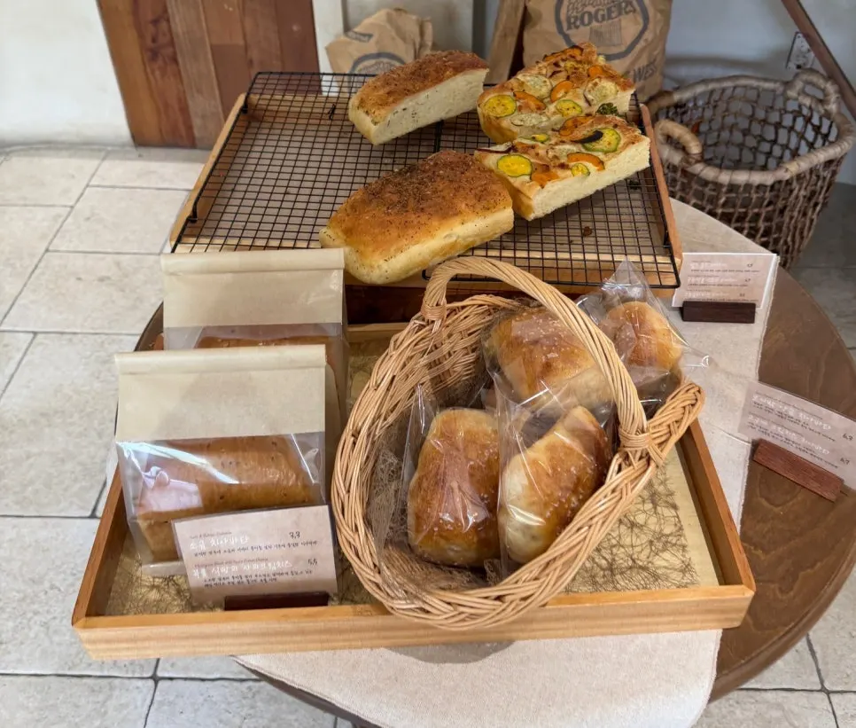 Ciabatta and sliced bread in wooden boxes