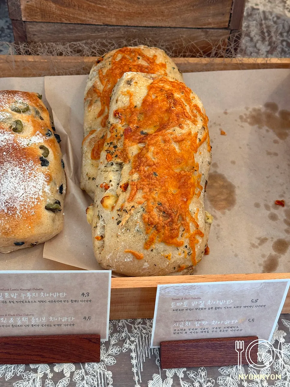 Cross-section of the sweet potato cream cheese ciabatta with a crisp cracked top