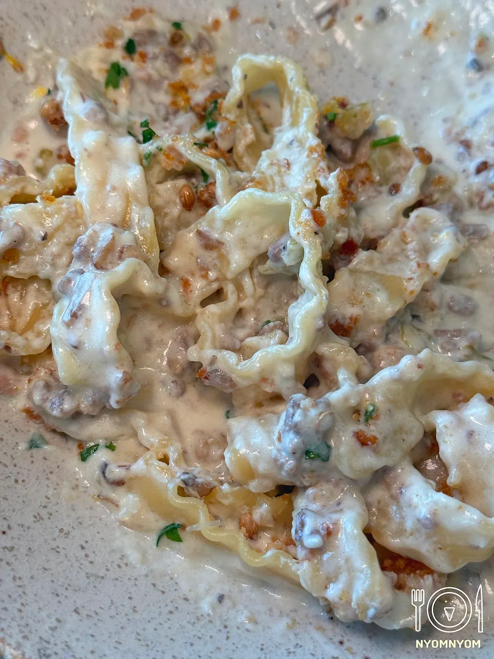 White ragu cream pasta topped with lemon