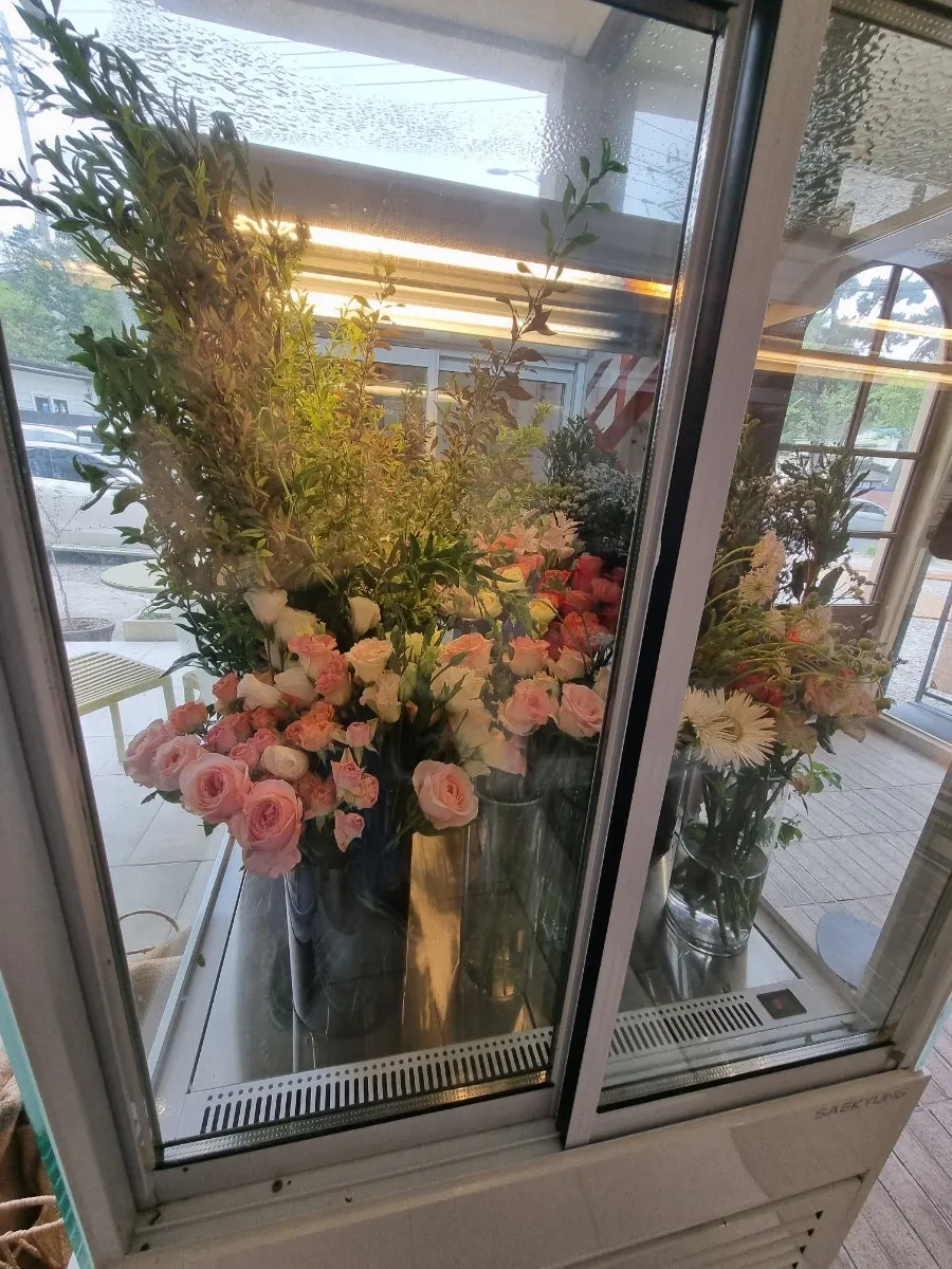 A corner of the café with fresh flowers for sale