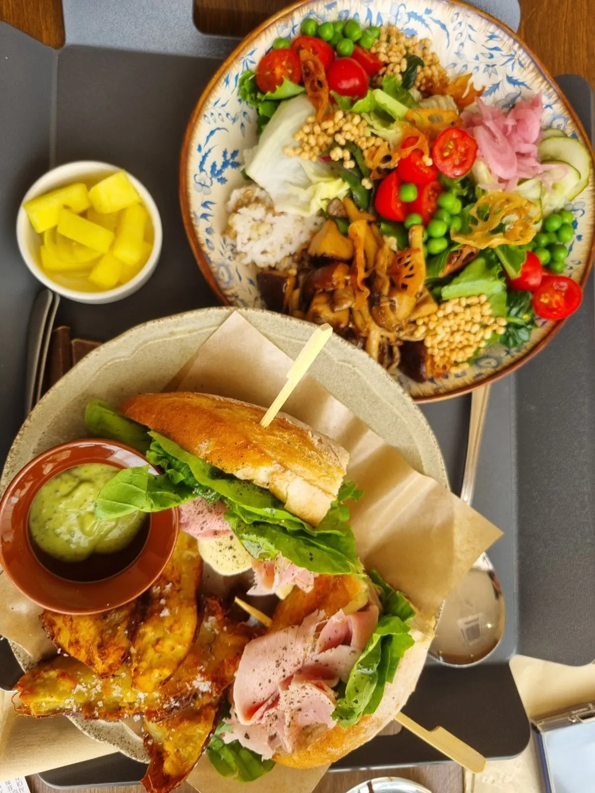 Brunch spread with sandwich, salad, and ciabatta