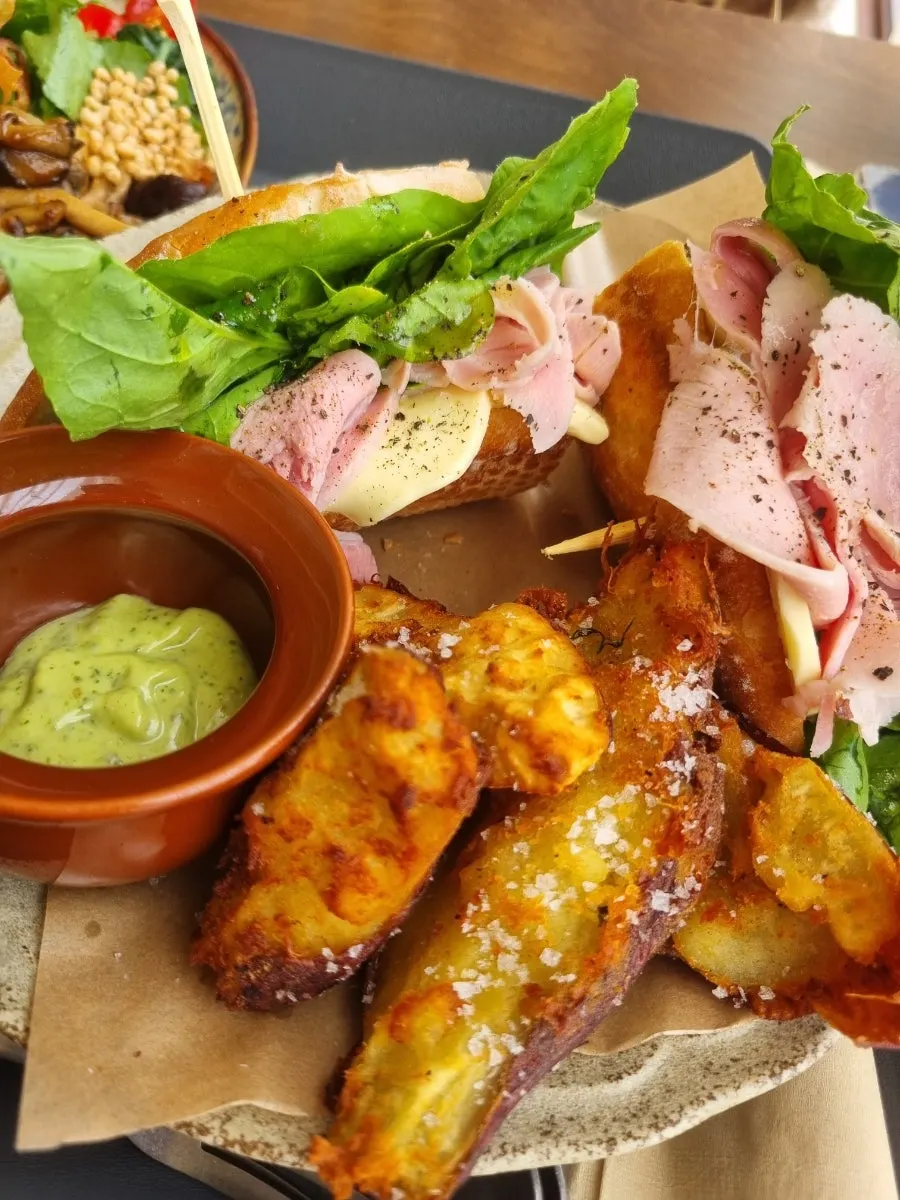 A plate of rucola jambon-beurre sandwich