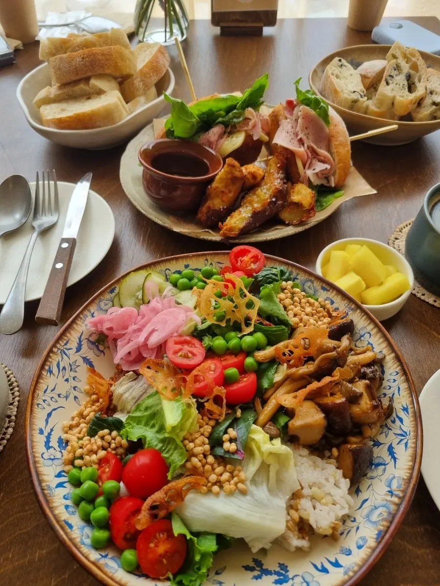 Brunch spread with salad and sandwich together