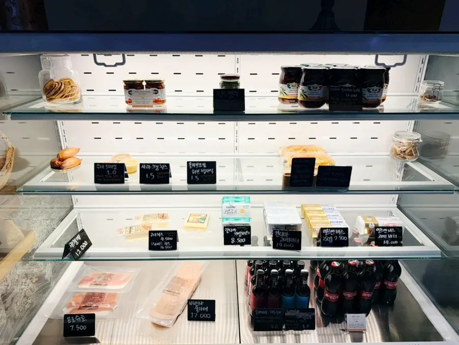 Shelf of jams and oils at Mandali To Go