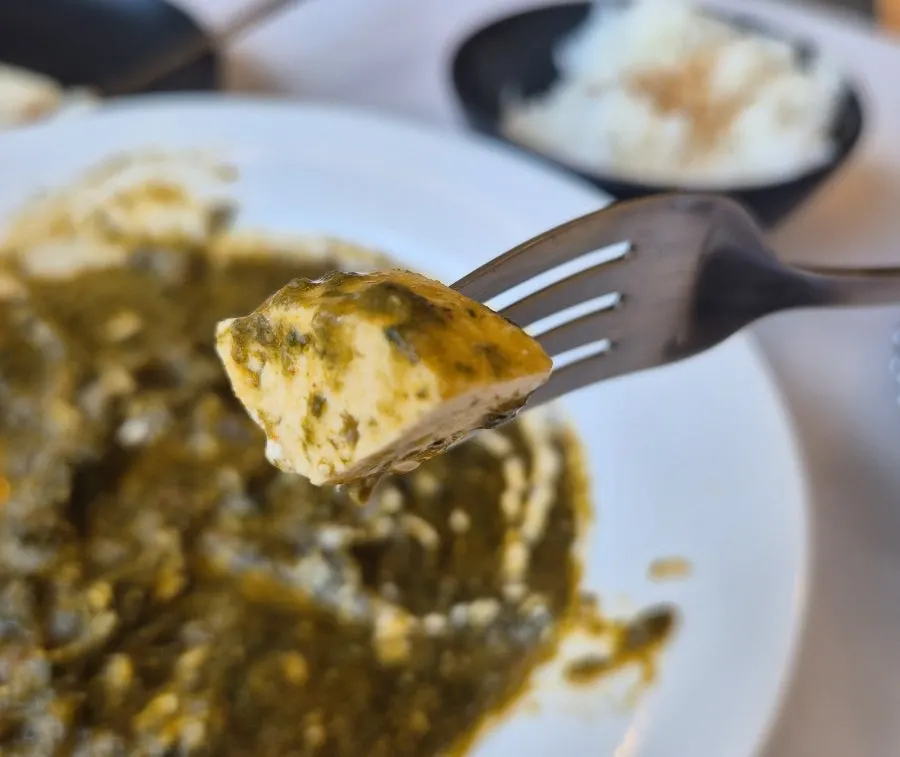 Green-colored paneer spinach curry