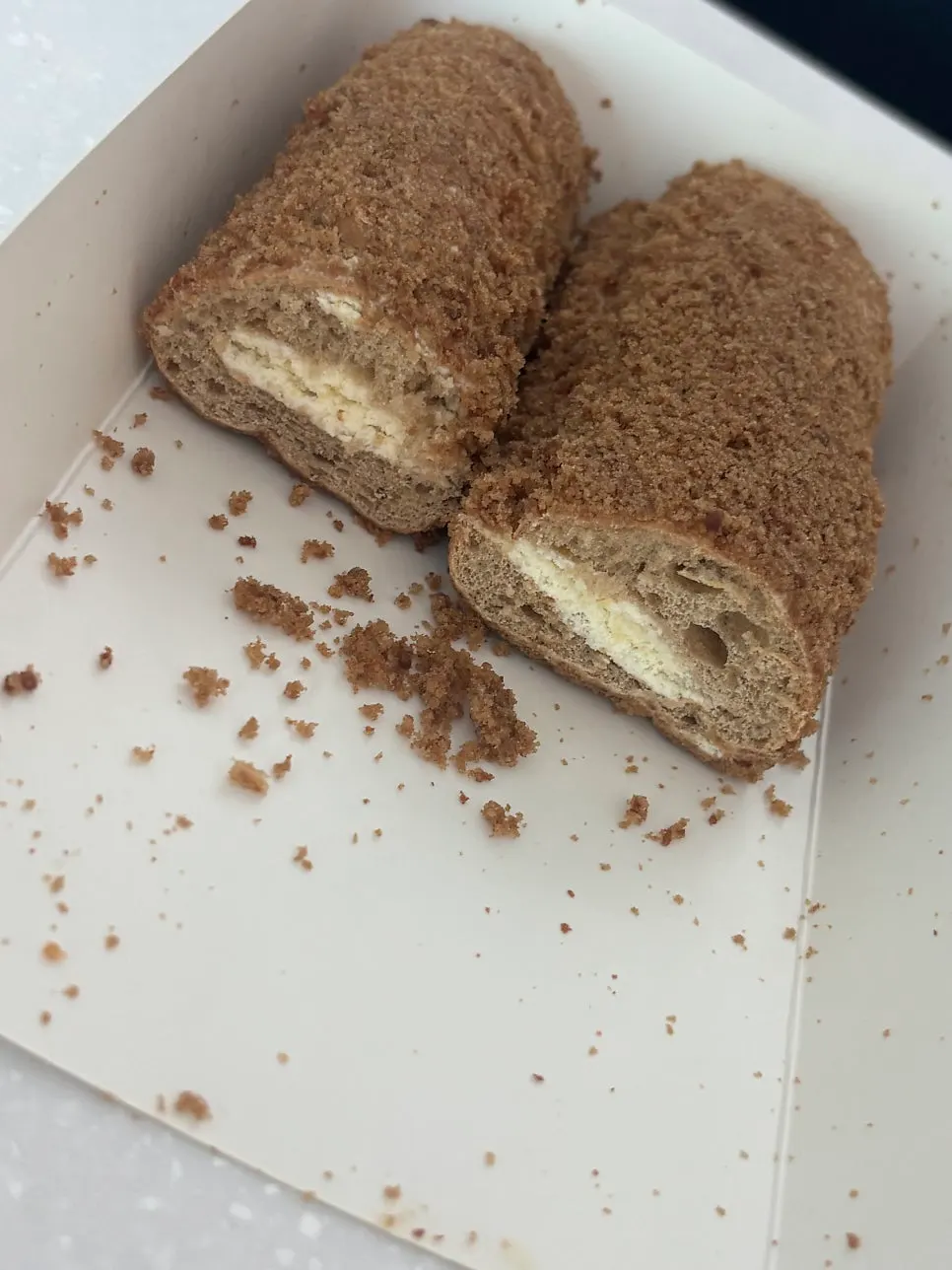 Cross-section of the cappuccino bun dusted with coffee powder