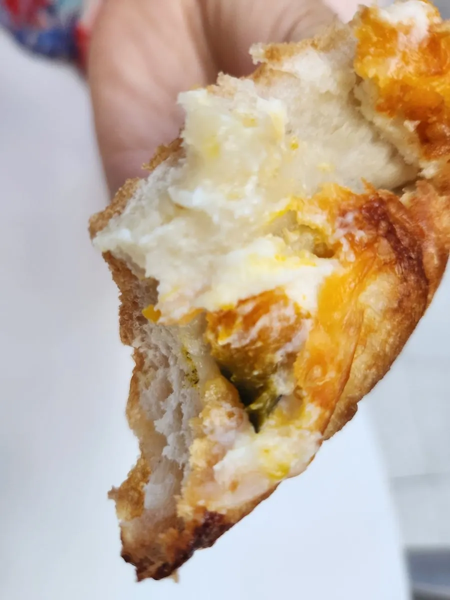 A heavy sweet pumpkin ciabatta held in hand