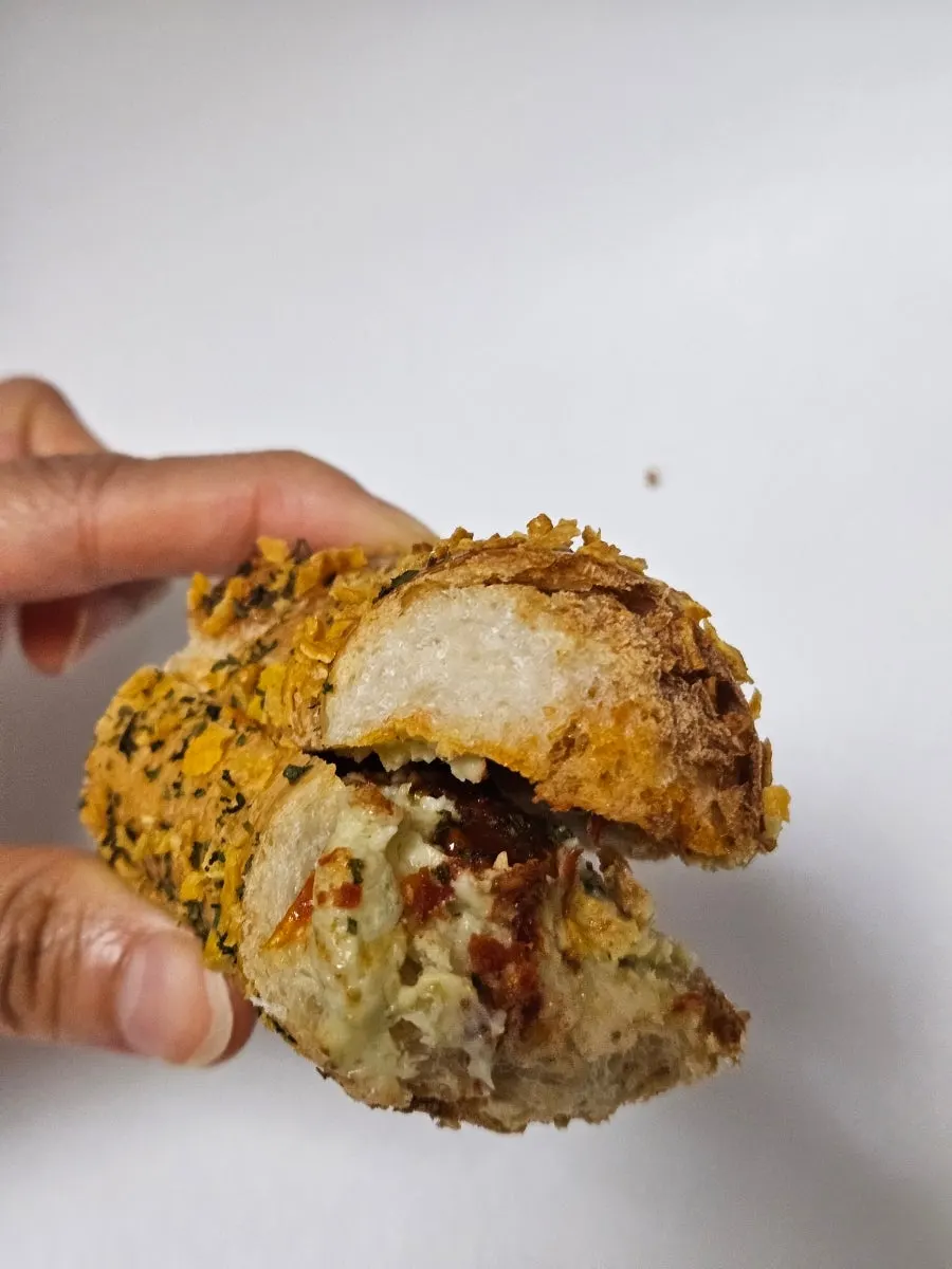 Basil tomato bagel split in half