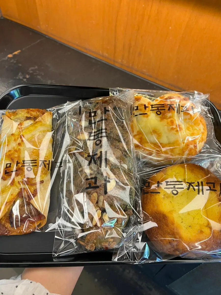 Tray of breads carried to the checkout counter