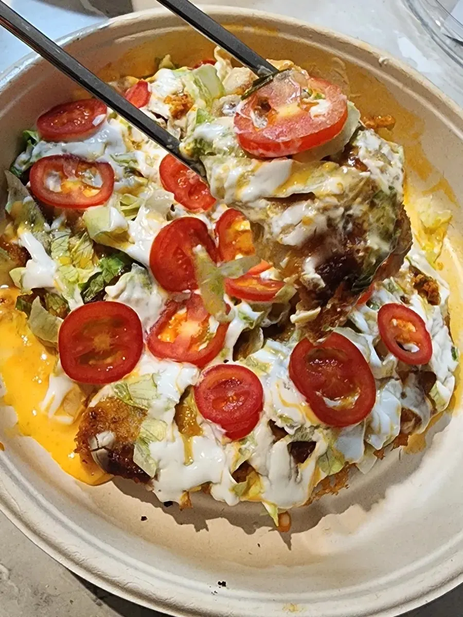 Crispy K-gyoza piled high with taco sauce