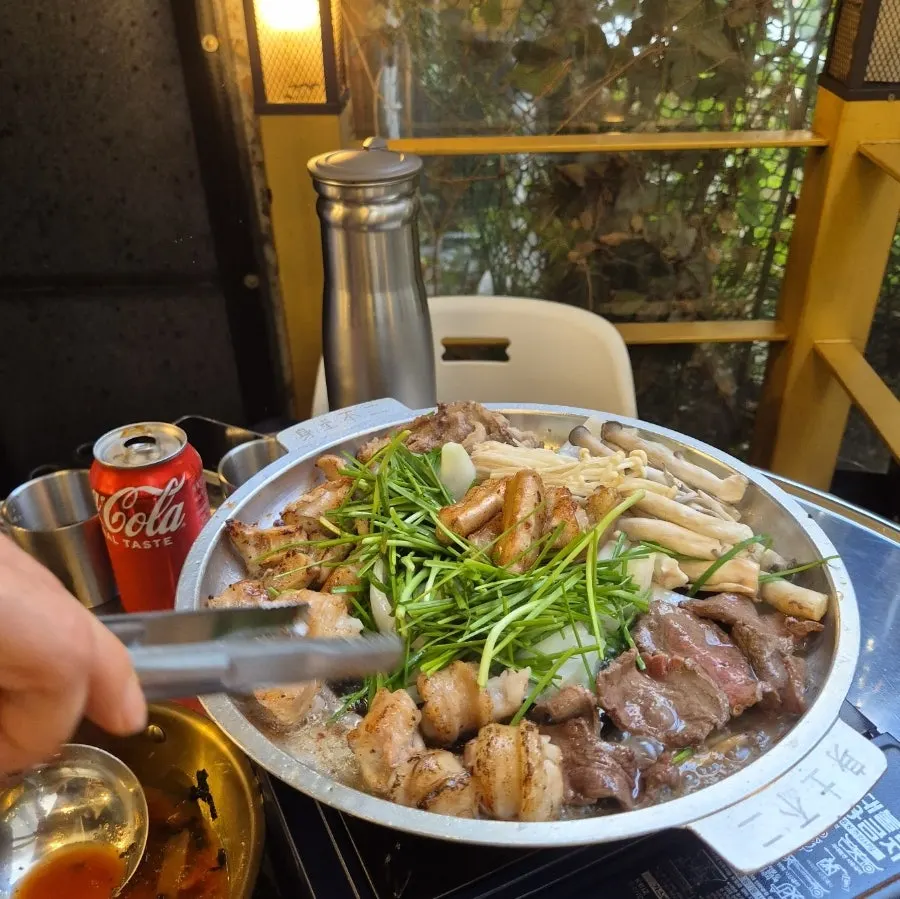 Staff grilling the gopchang to just the right doneness